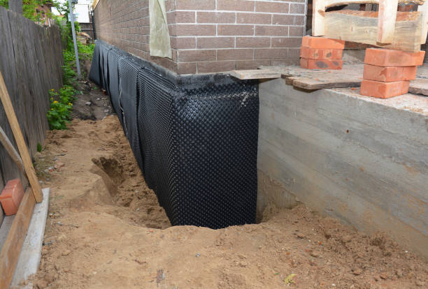 Happy homeowners after waterproofing job in Richfield